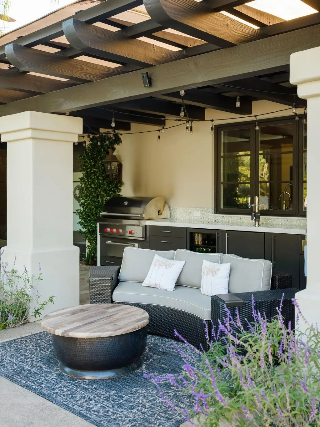 18072 Rancho La Cima Corte Rancho Santa Fe, CA 92067 - Photo 16 of 32 a view of a porch with furniture and plants