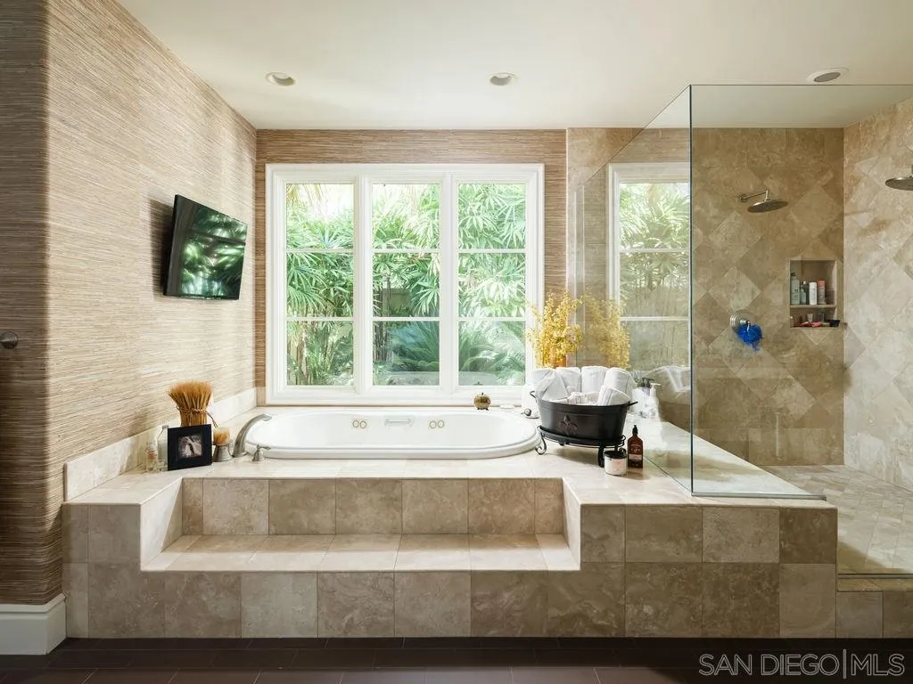 18072 Rancho La Cima Corte Rancho Santa Fe, CA 92067 - Photo 19 of 32 a living room with large window and a table