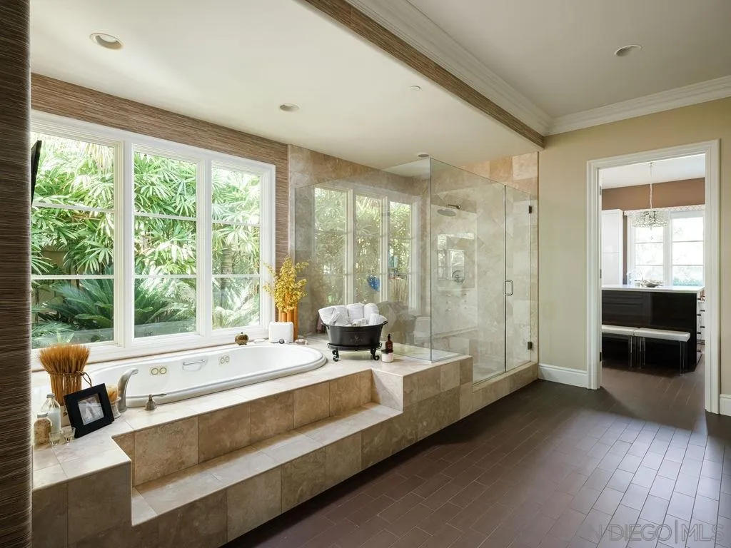 18072 Rancho La Cima Corte Rancho Santa Fe, CA 92067 - Photo 20 of 32 a large living room with a large window and furniture