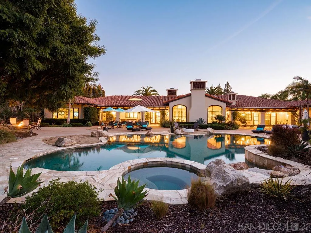 18072 Rancho La Cima Corte Rancho Santa Fe, CA 92067 - Photo 2 of 32 a view of a swimming pool with outdoor seating