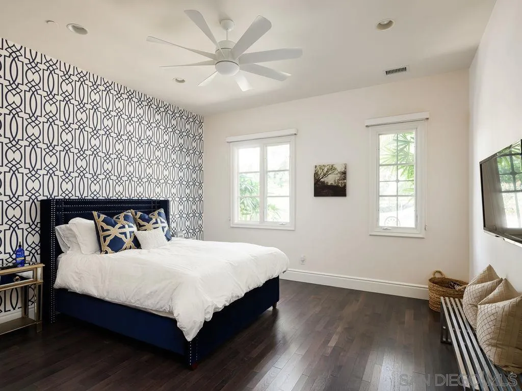 18072 Rancho La Cima Corte Rancho Santa Fe, CA 92067 - Photo 24 of 32 a bedroom with a bed and wooden floor