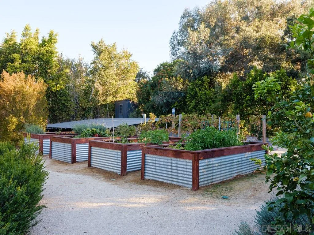 18072 Rancho La Cima Corte Rancho Santa Fe, CA 92067 - Photo 29 of 32 a view of a bench in a garden