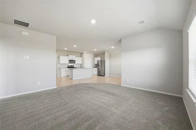 a view of a kitchen with a sink and cabinets