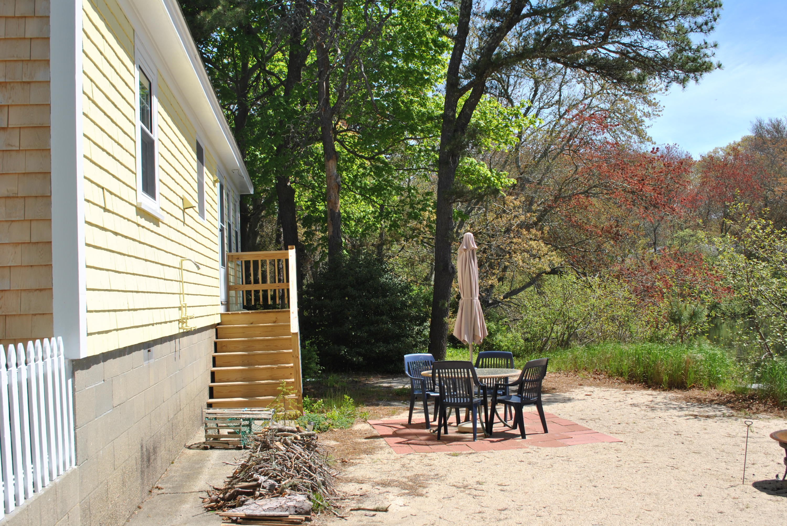 83 Lake Drive Centerville, MA 02632 - Photo 25 of 35 a view of a two chairs in the porch