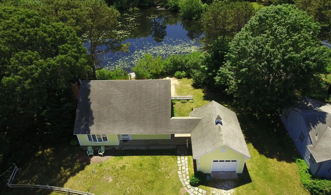 83 Lake Drive Centerville, MA 02632 - Photo 31 of 35 an aerial view of a house with yard swimming pool and outdoor seating