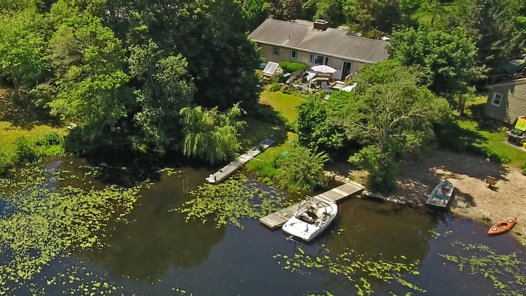 83 Lake Drive Centerville, MA 02632 - Photo 32 of 35 an aerial view of a house with a yard