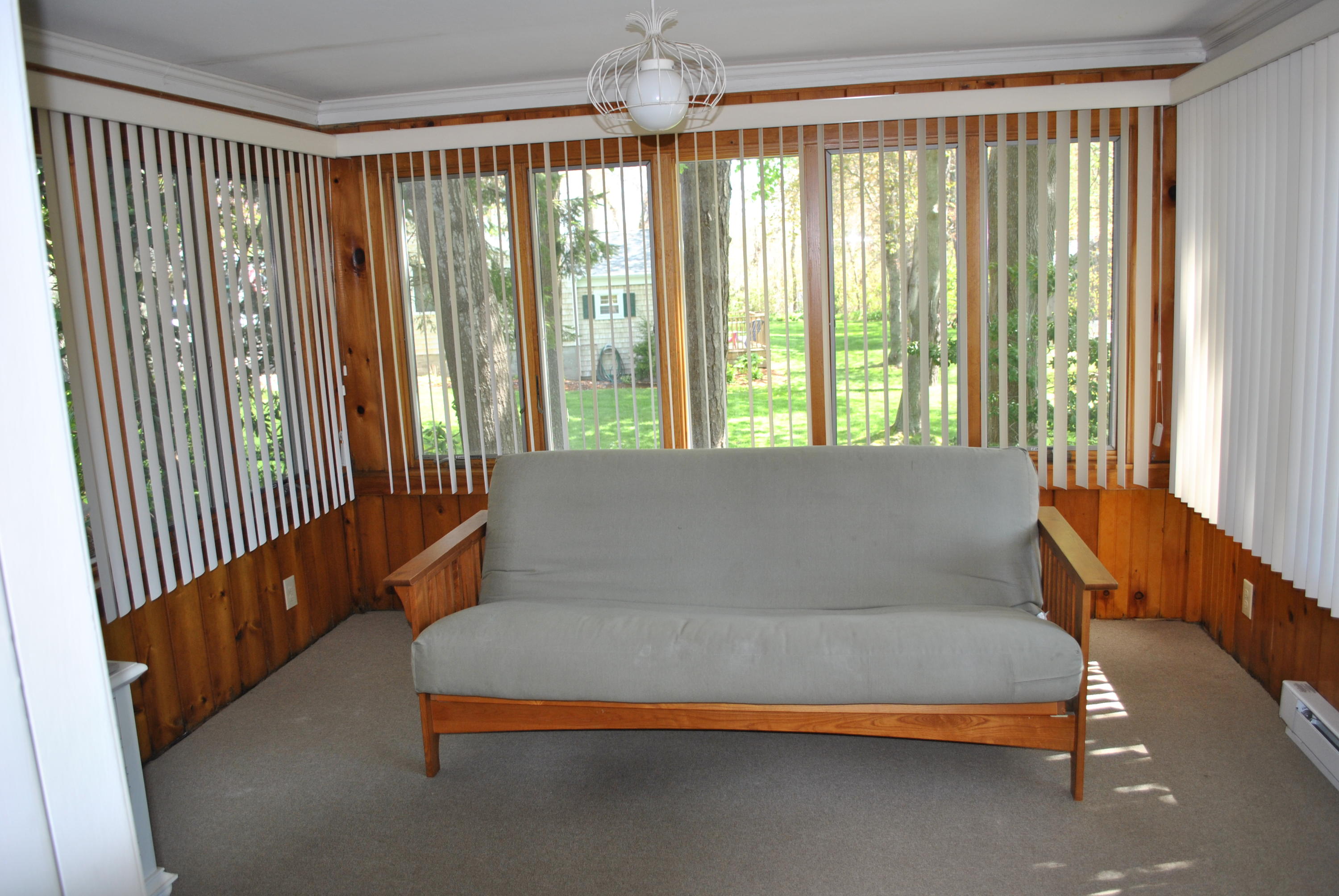 83 Lake Drive Centerville, MA 02632 - Photo 6 of 35 a bedroom with furniture and large windows