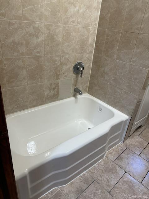3191 Fulton Street Brooklyn, NY 11208 - Photo 3 of 8 a bathroom with a bathtub