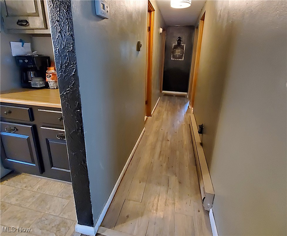 13075 Conquer Hill Road Byesville, OH 43723 - Photo 17 of 36 Hallway featuring light wood-type flooring