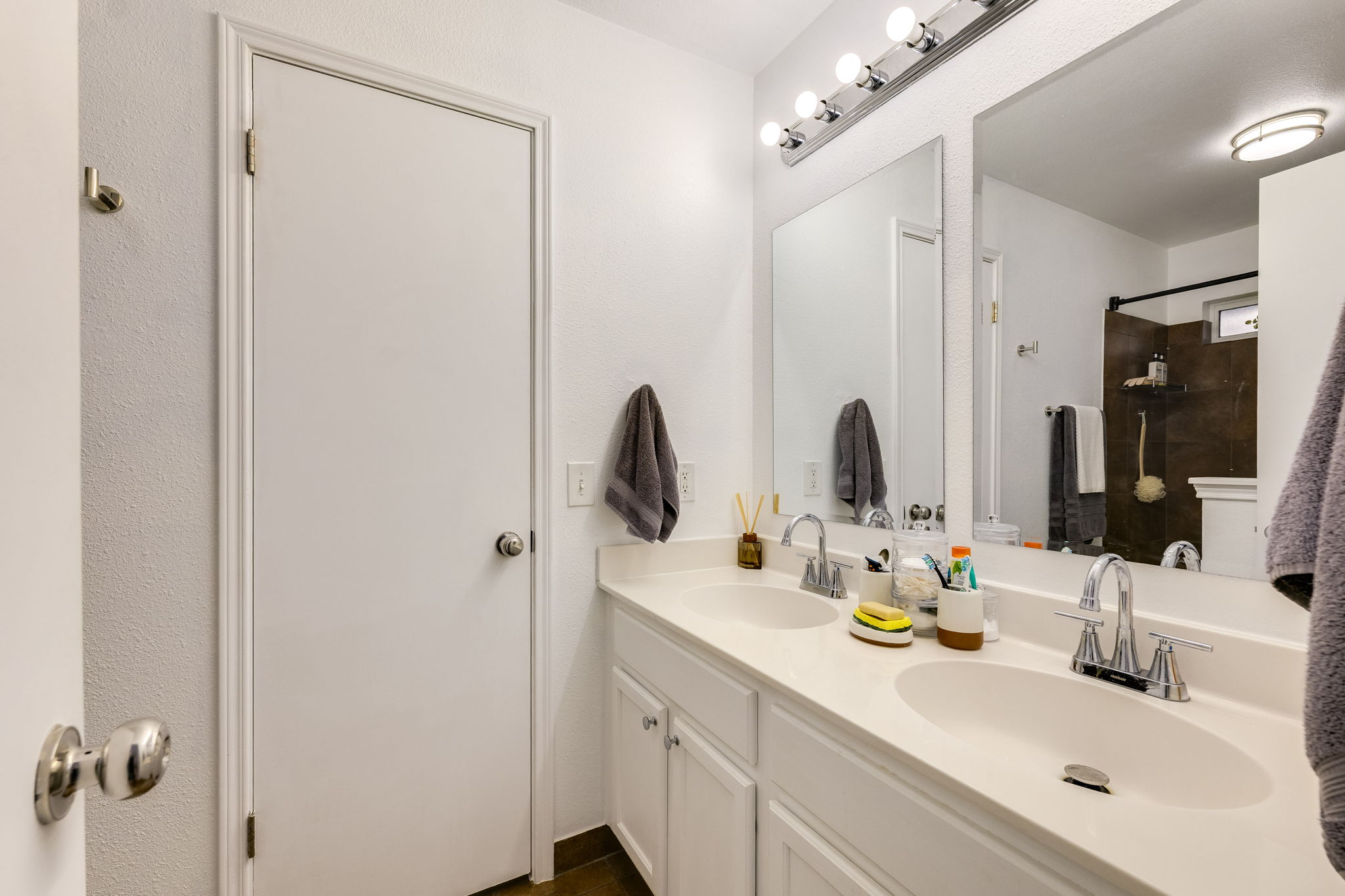 507 Clear Spring Lane Leander, TX 78641 - Photo 18 of 25 a bathroom with double vanity sink and a mirror