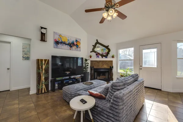 a living room with furniture and a flat screen tv
