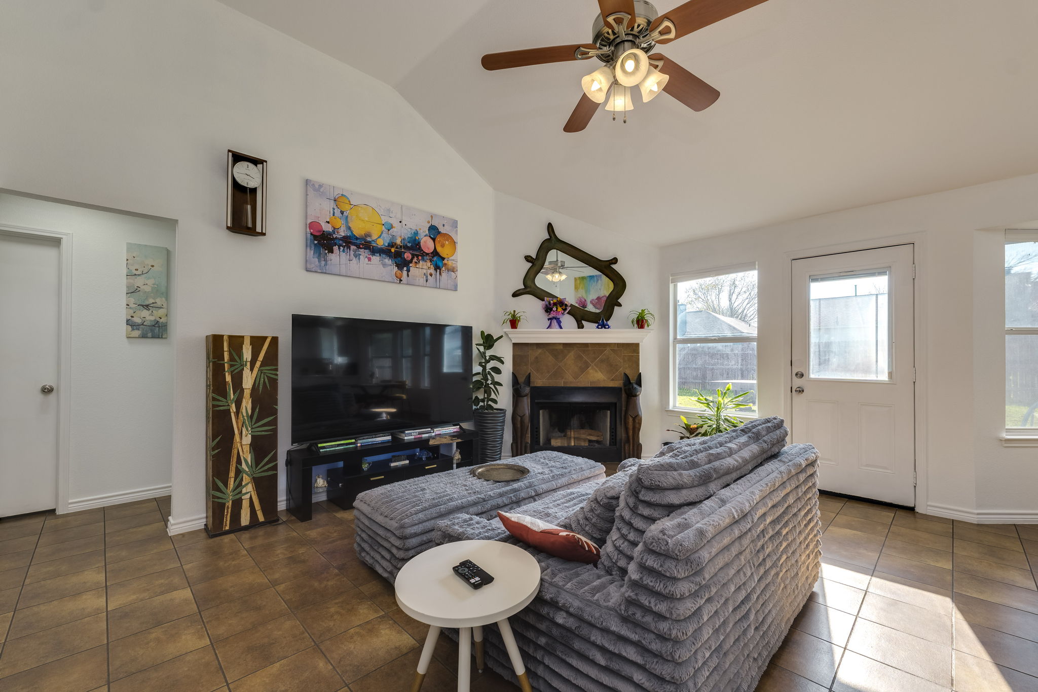 507 Clear Spring Lane Leander, TX 78641 - Photo 6 of 25 a living room with furniture a flat screen tv and a fireplace