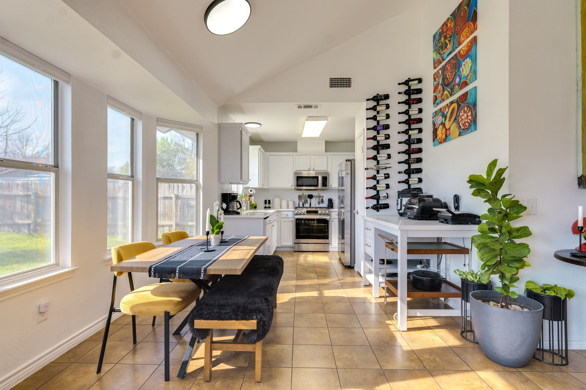 507 Clear Spring Lane Leander, TX 78641 - Photo 8 of 25 a dining room with furniture potted plants and wooden floor
