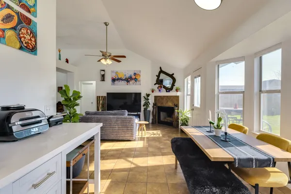 a kitchen with a sink a stove and cabinets