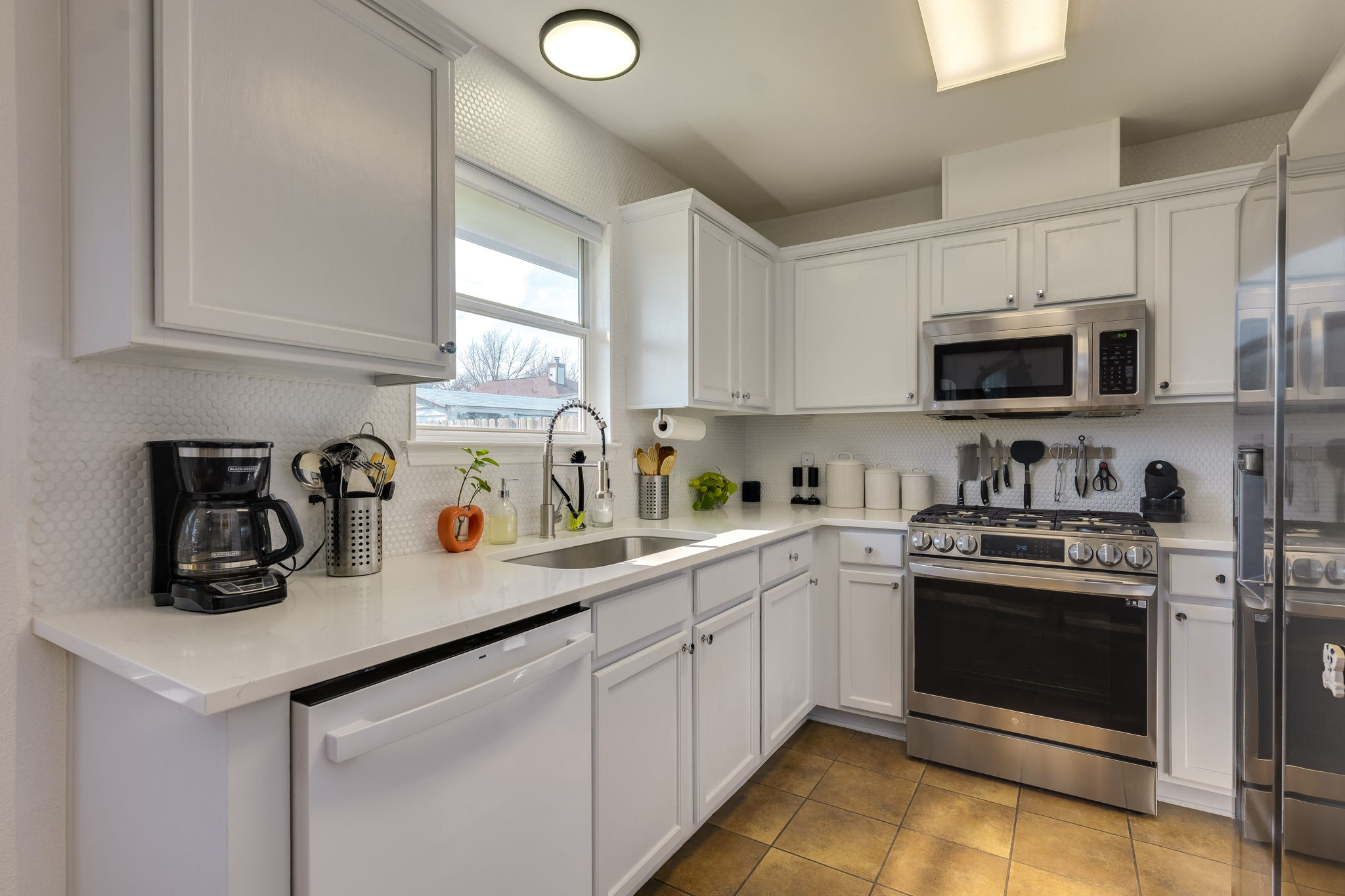 507 Clear Spring Lane Leander, TX 78641 - Photo 10 of 25 a kitchen with a sink a stove and cabinets