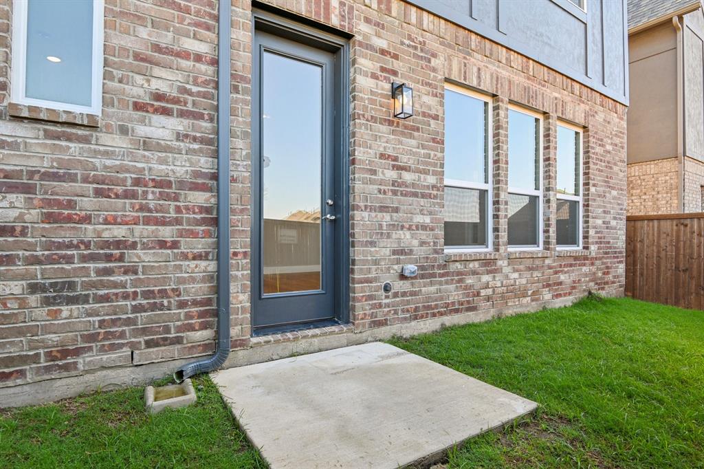 1711 Paytyn Drive Allen, TX 75013 - Photo 29 of 37 View of exterior entry featuring a lawn