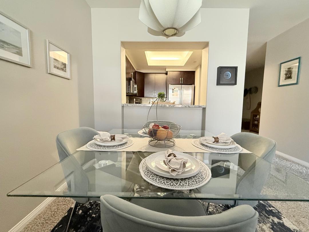144 South 3rd Street, Unit 508 San Jose, CA 95112 - Photo 11 of 23 a dining room with furniture and wooden floor
