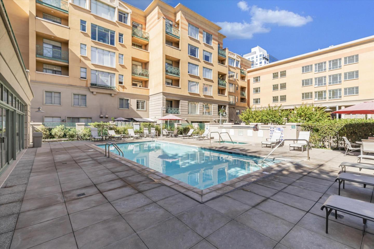 144 South 3rd Street, Unit 508 San Jose, CA 95112 - Photo 2 of 23 a view of a swimming pool and a outdoor space
