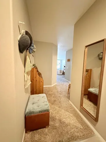 a bedroom with a bed and bathroom view