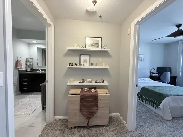 a bedroom with a bed and a view of bedroom