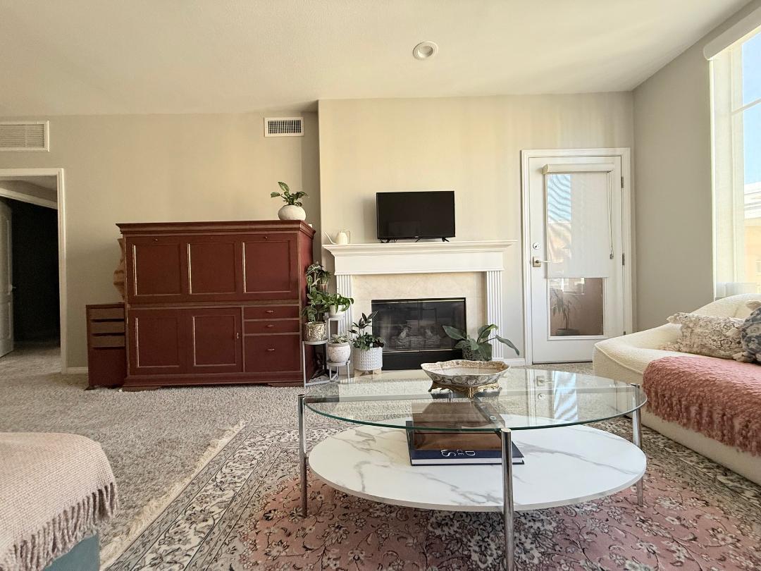 144 South 3rd Street, Unit 508 San Jose, CA 95112 - Photo 10 of 23 a living room with furniture and a fireplace
