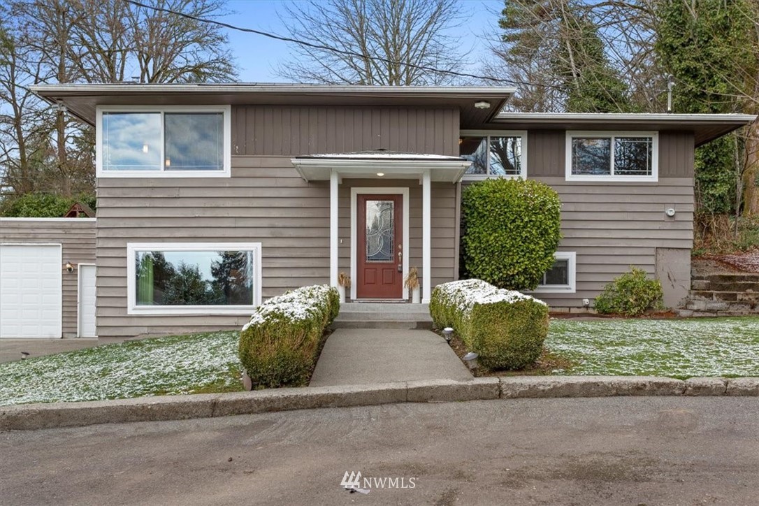 17526 Southeast 135th Street Renton, WA 98059 - Photo 1 of 37 a front view of a house with garden