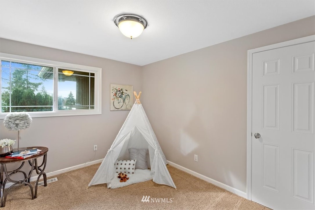 17526 Southeast 135th Street Renton, WA 98059 - Photo 20 of 37 a view of a livingroom with furniture and windows