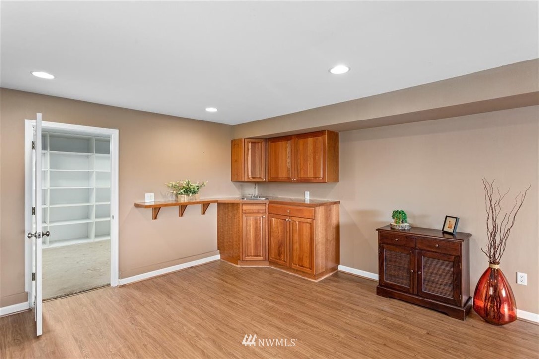 17526 Southeast 135th Street Renton, WA 98059 - Photo 24 of 37 a view of a livingroom with kitchen and furniture