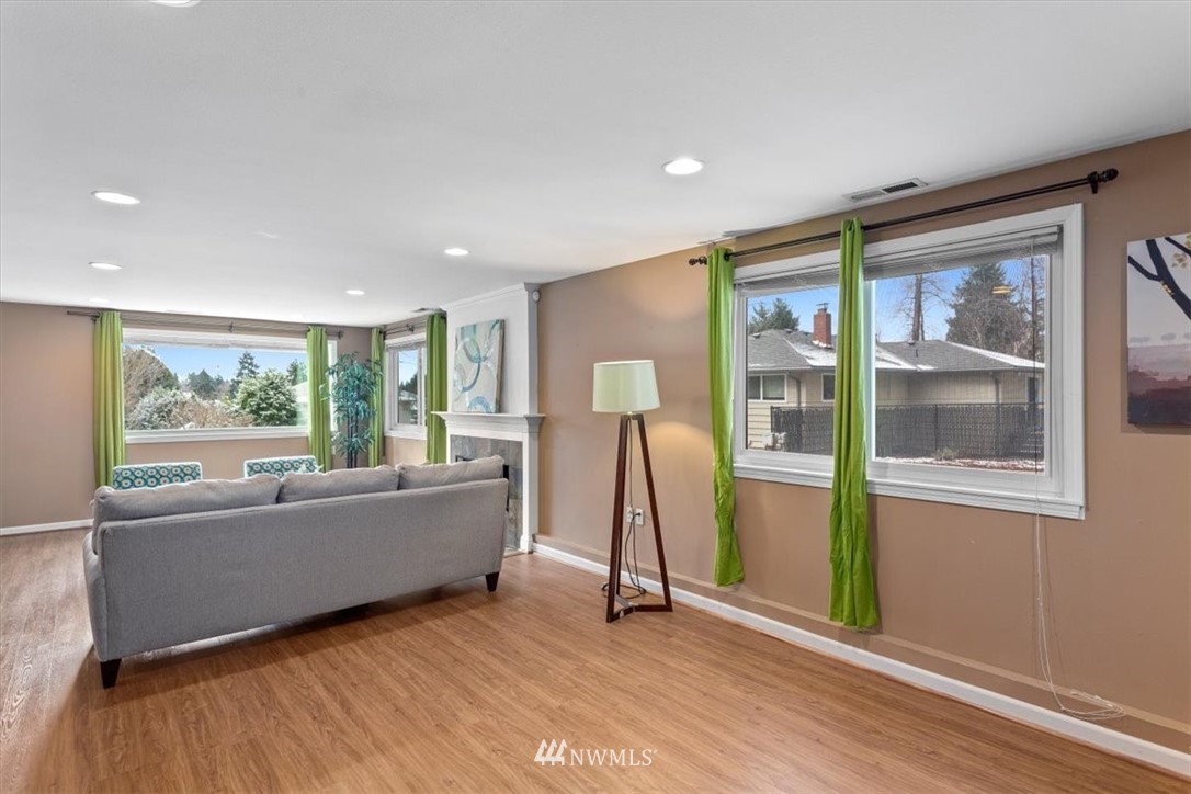 17526 Southeast 135th Street Renton, WA 98059 - Photo 26 of 37 a living room with a couch and a table