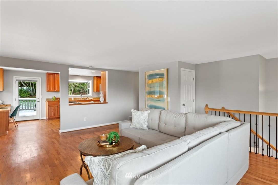 17526 Southeast 135th Street Renton, WA 98059 - Photo 5 of 37 a living room with furniture and a wooden floor