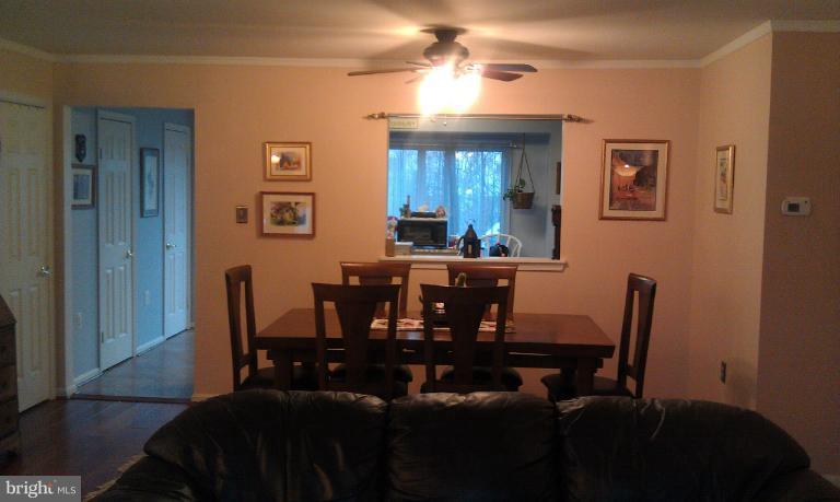 7353 St Thomas Loop Manassas, VA 20109 - Photo 2 of 20 a view of a dining room with furniture and window