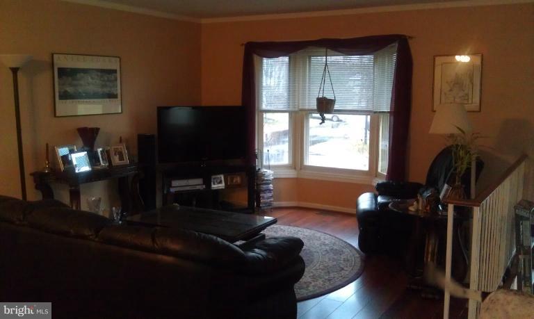 7353 St Thomas Loop Manassas, VA 20109 - Photo 13 of 20 a living room with furniture and a flat screen tv