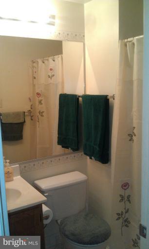 7353 St Thomas Loop Manassas, VA 20109 - Photo 6 of 20 a bathroom with a sink and a mirror