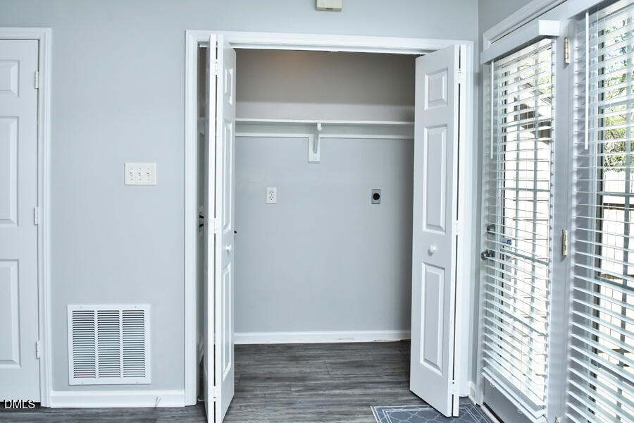 6 Justin Court Durham, NC 27705 - Photo 14 of 22 a view of an empty room with wooden floor and a window