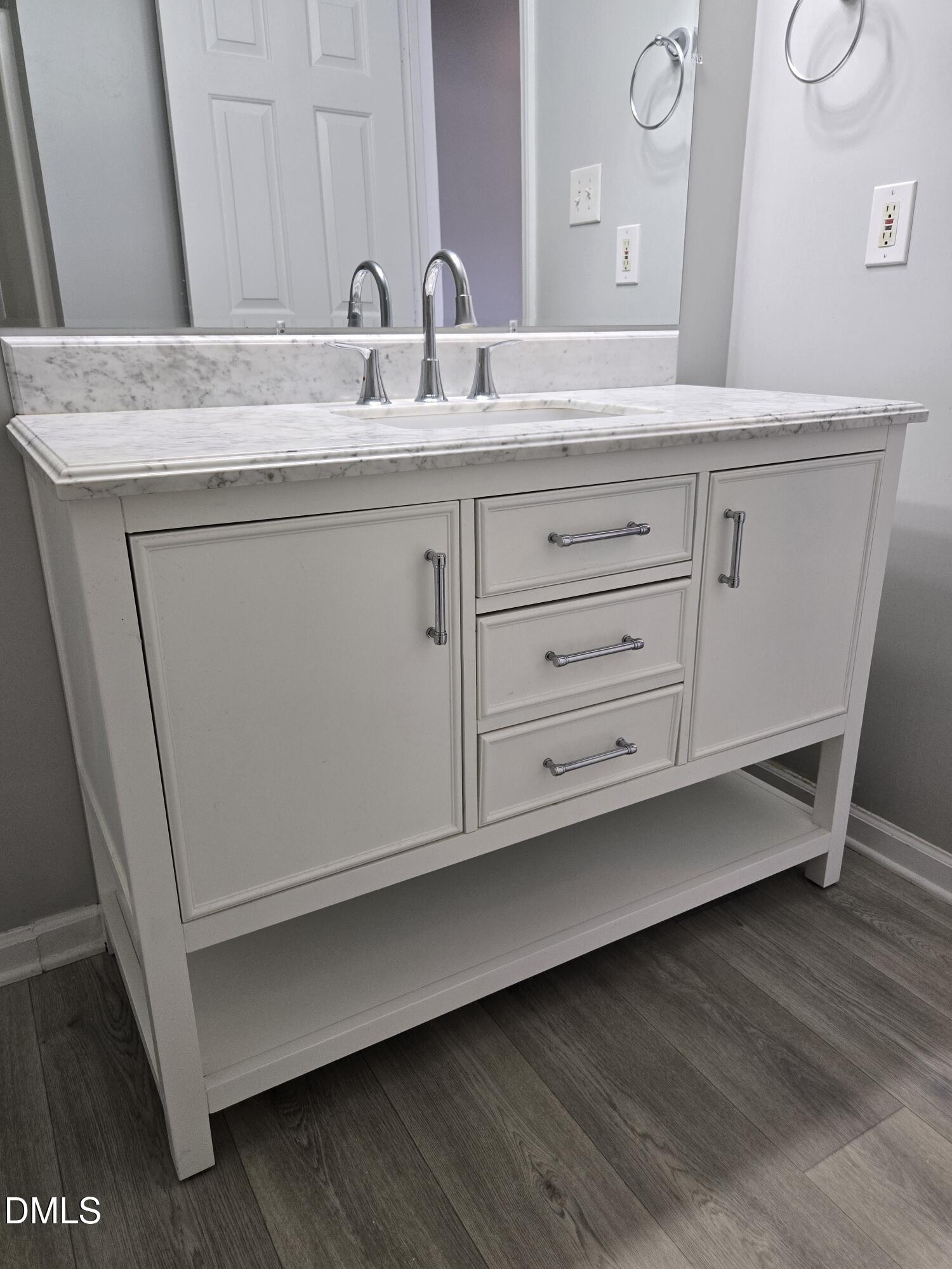 6 Justin Court Durham, NC 27705 - Photo 20 of 22 a bathroom with a sink and a mirror