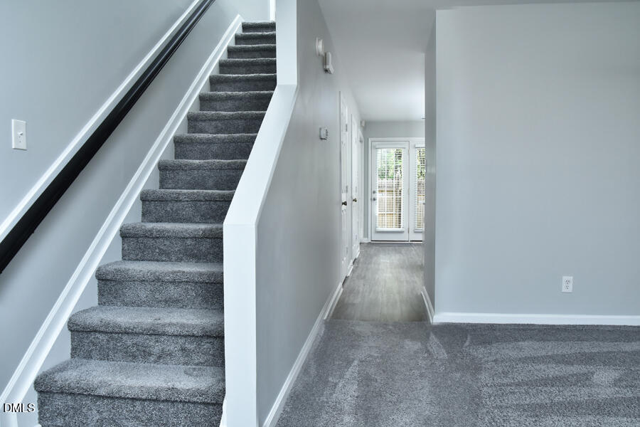6 Justin Court Durham, NC 27705 - Photo 7 of 22 a view of staircase with wooden floor and white walls