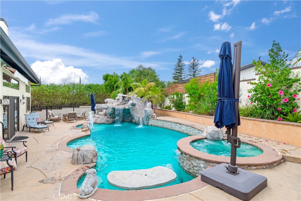 2429 Cliff Road Upland, CA 91784 - Photo 33 of 44 Rock water fall pool with slide and table. Baja shelf