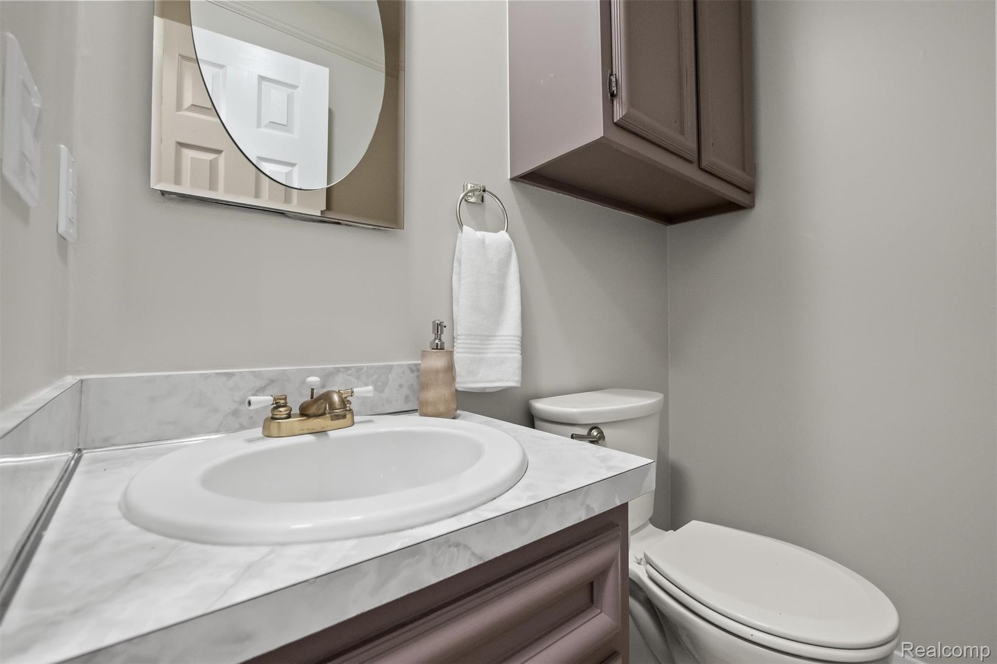 11326 Common Road Warren, MI 48093 - Photo 25 of 35 Half bathroom with vanity and toilet