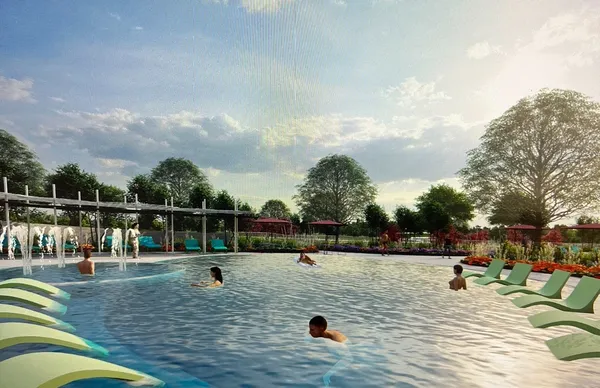 a view of residential houses with outdoor space and swimming pool