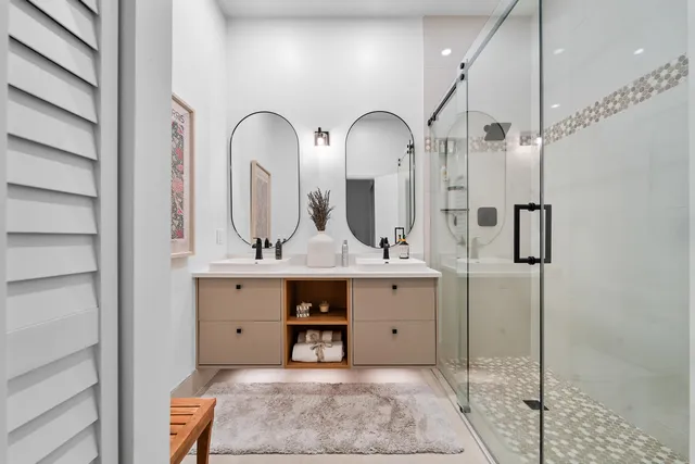 a bedroom with bed and a potted plant