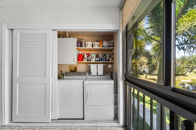 a bathroom with a double vanity sink mirror and shower