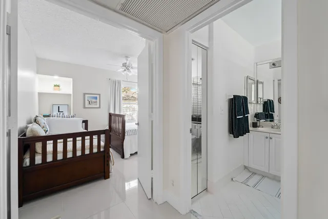 a bathroom with a toilet a sink and shower