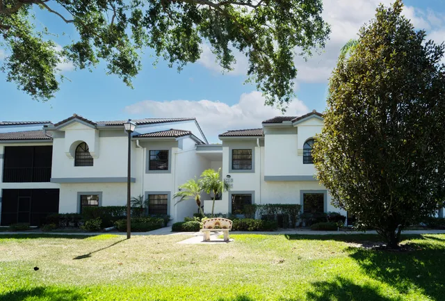 a view of a bedroom with furniture and windows
