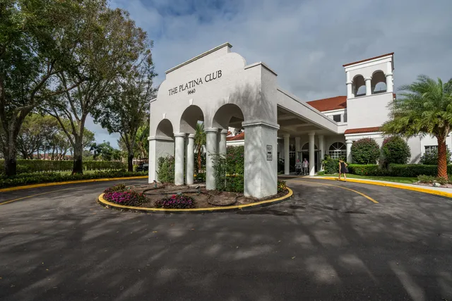 a view of a house with a yard in a patio