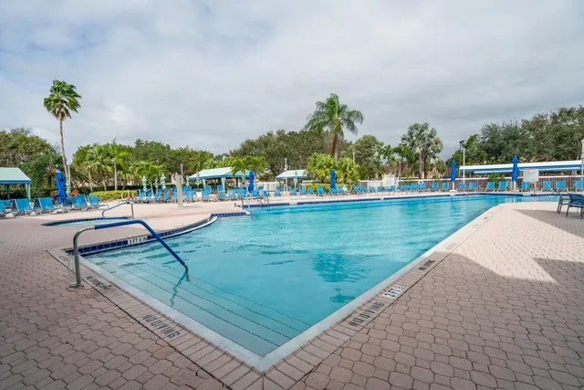 a living room with furniture and a book shelf