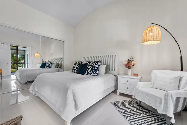 a kitchen with a refrigerator sink stove and cabinets