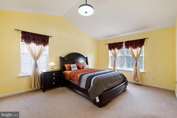a bed room with a bed and a window
