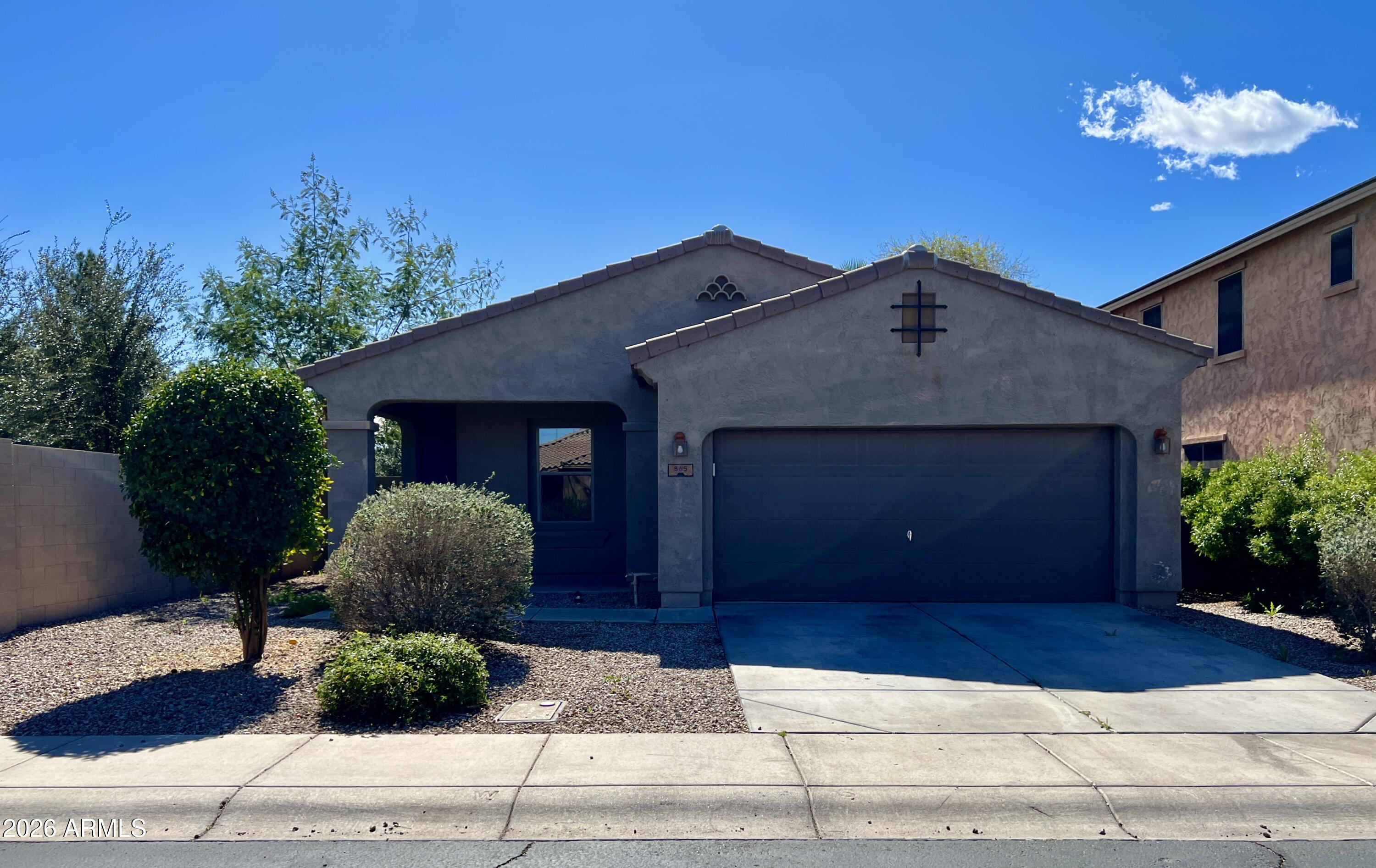 a house view with a garden space
