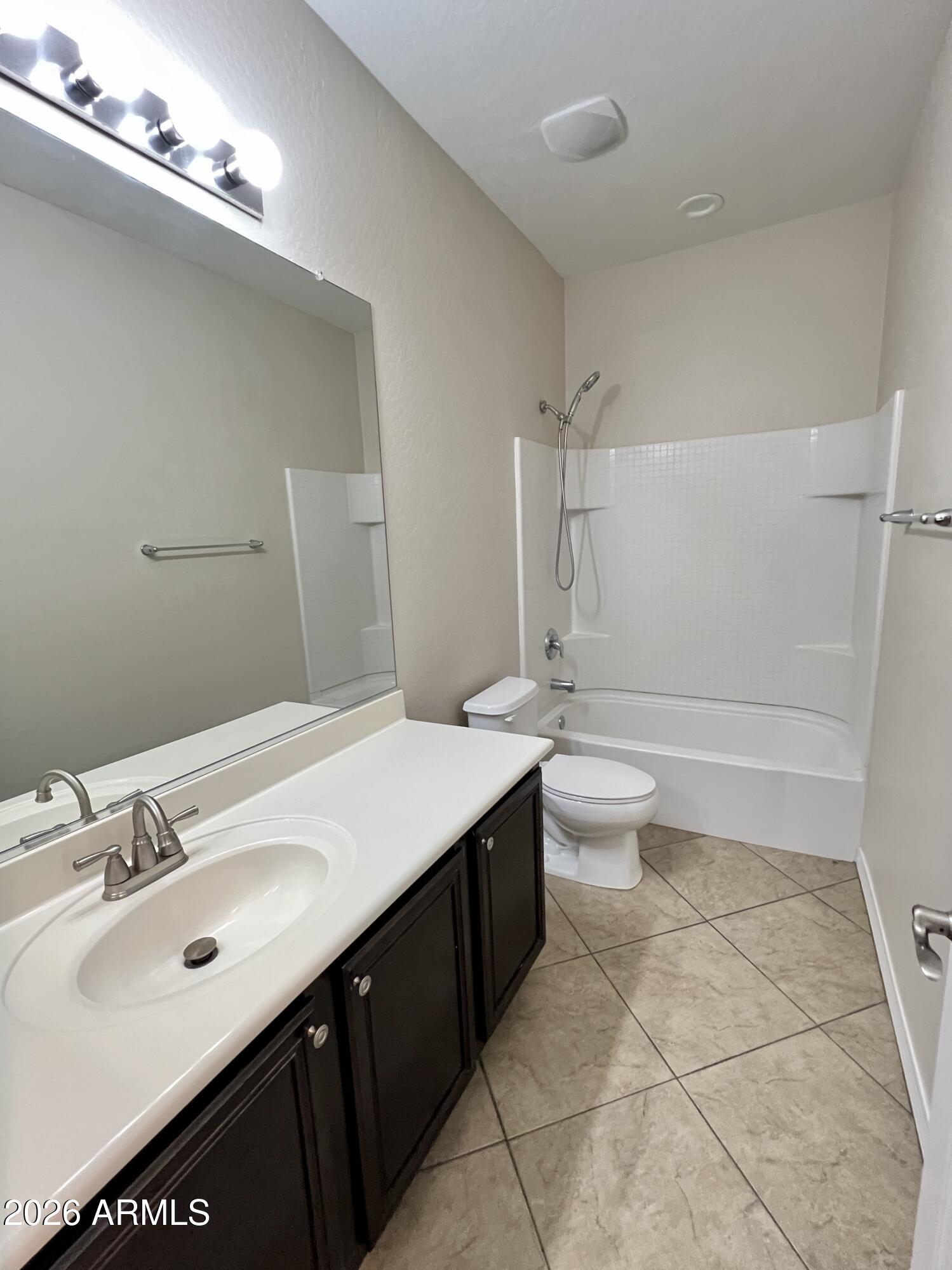 865 East Del Rio Street Chandler, AZ 85225 - Photo 10 of 15 a bathroom with a double vanity sink mirror and toilet