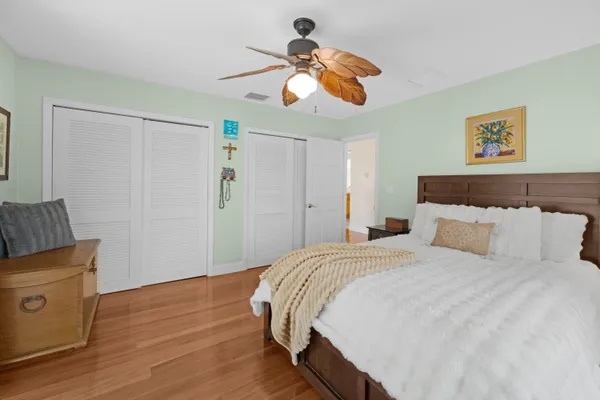 a view of a chairs and table in the balcony